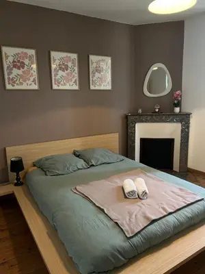 Un ou plusieurs lits dans un hébergement de l'établissement Maison de ville