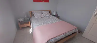 Un ou plusieurs lits dans un hébergement de l'établissement La chambre aux Iris