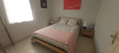 Un ou plusieurs lits dans un hébergement de l'établissement La chambre aux Iris