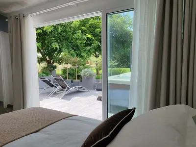 Un ou plusieurs lits dans un hébergement de l'établissement Cottage Escale Nature & Sérénité - spa privatif