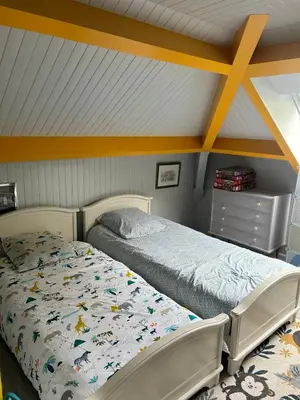 Un ou plusieurs lits dans un hébergement de l'établissement Chambre CHEZ L'HABITANT