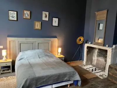 Un ou plusieurs lits dans un hébergement de l'établissement Entre fleuve et ville, charmante petite maison 18e