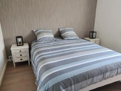 Un ou plusieurs lits dans un hébergement de l'établissement Maison Cosy Porte de La Rochelle