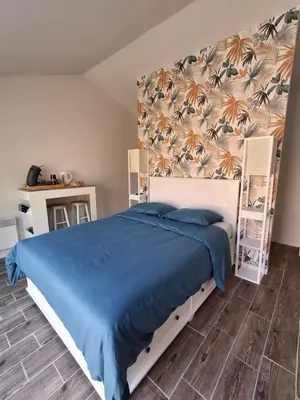 Un ou plusieurs lits dans un hébergement de l'établissement Chambre suite avec terrasse