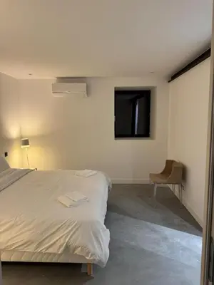 Un ou plusieurs lits dans un hébergement de l'établissement Il Clovio - Discreet luxury, close to Futuroscope