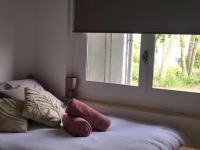 Un ou plusieurs lits dans un hébergement de l'établissement Studio Moderne et Confortable - Clim & Futuroscope