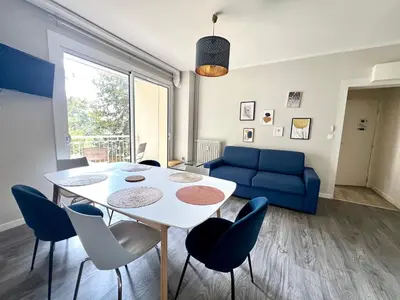 Coin salon dans l'établissement Le Printanier, T3 avec suite parental avec balcon
