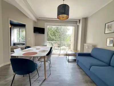 Coin salon dans l'établissement Le Printanier, T3 avec suite parental avec balcon