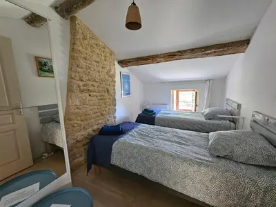 Un ou plusieurs lits dans un hébergement de l'établissement Maison Charentaise avec piscine et boulodrome