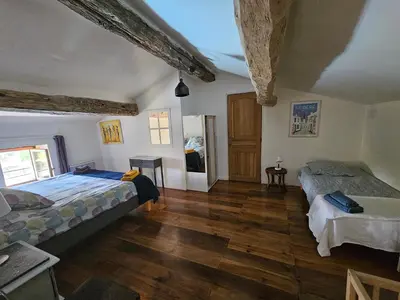 Un ou plusieurs lits dans un hébergement de l'établissement Maison Charentaise avec piscine et boulodrome