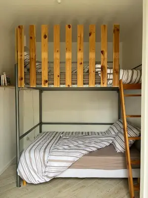 Un ou plusieurs lits dans un hébergement de l'établissement Cottage 50m de la plage