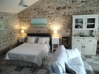 Un ou plusieurs lits dans un hébergement de l'établissement Charming pied-à-terre