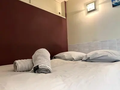 Un ou plusieurs lits dans un hébergement de l'établissement ღ Le Nérée - Au cœur du vieux port et cosy