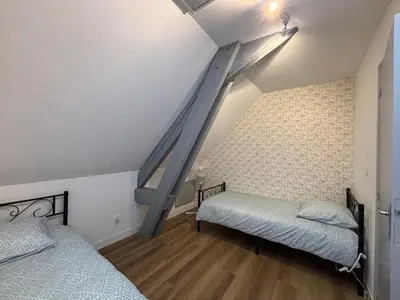 Un ou plusieurs lits dans un hébergement de l'établissement Parenthèse Poitevine - Maison 3 chambres à 5 min du Futuroscope