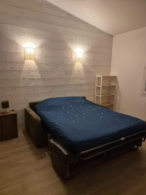 Un ou plusieurs lits dans un hébergement de l'établissement Maisonnette près de la plage