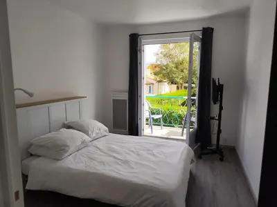 Un ou plusieurs lits dans un hébergement de l'établissement Appartement T3 idéalement situé