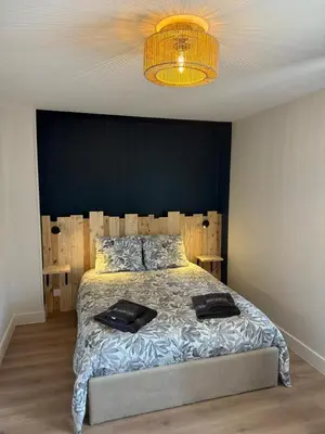Un ou plusieurs lits dans un hébergement de l'établissement Maison avec Jardin 6 Couchages & Parking gratuit à proximité du Futuroscope
