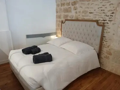Un ou plusieurs lits dans un hébergement de l'établissement Appartement lumineux & moderne au cœur du centre