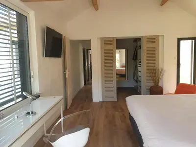Un ou plusieurs lits dans un hébergement de l'établissement Chambre suite de charme
