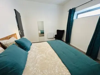 Un ou plusieurs lits dans un hébergement de l'établissement Le Loft Indus de Neuville- Futuroscope- Aquascope