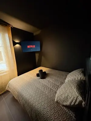 Un ou plusieurs lits dans un hébergement de l'établissement La Romantique