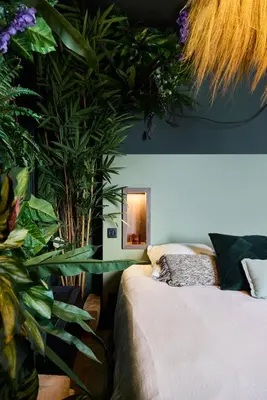 Un ou plusieurs lits dans un hébergement de l'établissement Love Room Évasion tropicale à deux pas du centre