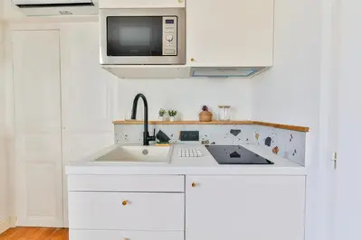 Cuisine ou kitchenette dans l'établissement Studio Nomade #Stationnement facile #1personne
