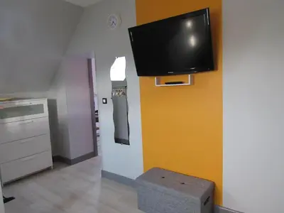 Télévision ou salle de divertissement dans l'établissement Le gite de la butte
