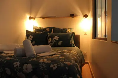 Un ou plusieurs lits dans un hébergement de l'établissement Studio cosy & ses troglos 