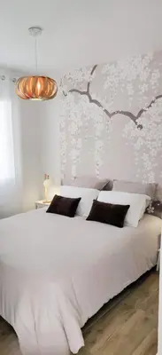 Un ou plusieurs lits dans un hébergement de l'établissement Petite maison cosy
