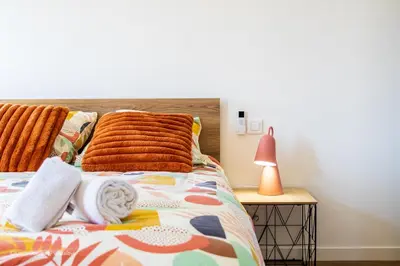 Un ou plusieurs lits dans un hébergement de l'établissement Casa Rochelaise - By Primo Conciergerie