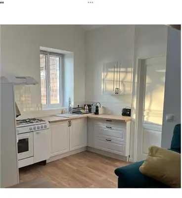 Cuisine ou kitchenette dans l'établissement Appartement calme