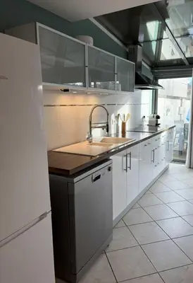 Cuisine ou kitchenette dans l'établissement La Laula