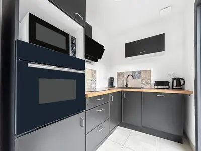 Cuisine ou kitchenette dans l'établissement Télétravail · 4 suites (sdb) · Bureaux · Terrasse