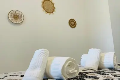 Un ou plusieurs lits dans un hébergement de l'établissement La Terrasse avec climatisation