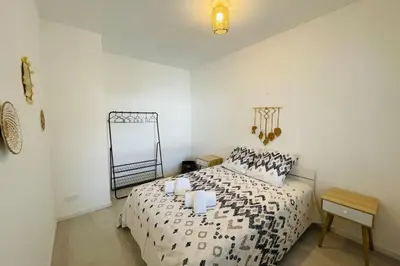 Un ou plusieurs lits dans un hébergement de l'établissement La Terrasse avec climatisation