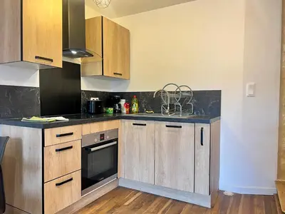 Cuisine ou kitchenette dans l'établissement Le souvenir Spacieux t2 aux portes du Futuroscope