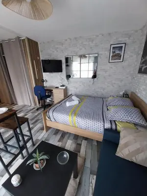 Un ou plusieurs lits dans un hébergement de l'établissement Studio Fontaine