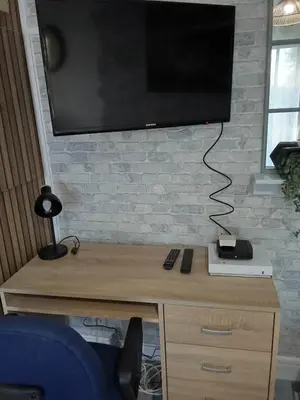 Télévision ou salle de divertissement dans l'établissement Studio Fontaine