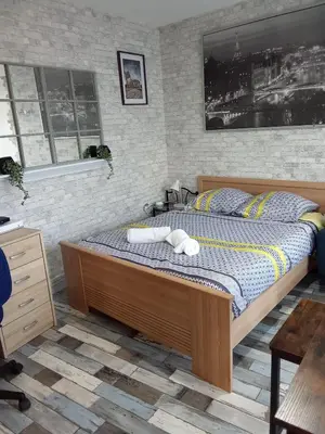 Un ou plusieurs lits dans un hébergement de l'établissement Studio Fontaine