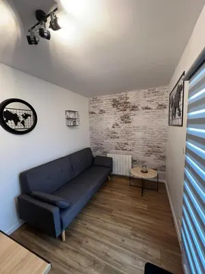Coin salon dans l'établissement Appartement avec terrasse