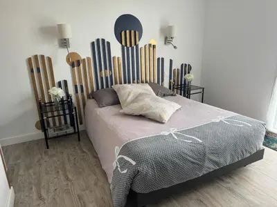 Un ou plusieurs lits dans un hébergement de l'établissement Petit studio attenant à la maison