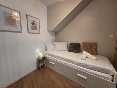 Un ou plusieurs lits dans un hébergement de l'établissement Le Simba - grand studio avec Wi-Fi