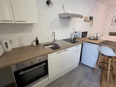 Cuisine ou kitchenette dans l'établissement Le Timon - large studio avec Wi-Fi
