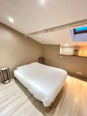 Un ou plusieurs lits dans un hébergement de l'établissement Le cosy duplex de l'Isle d'Espagnac
