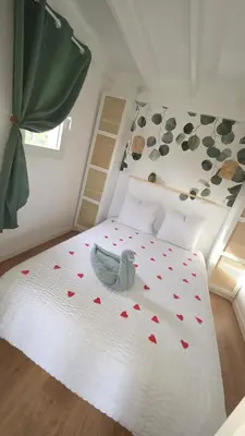 Un ou plusieurs lits dans un hébergement de l'établissement Cottage Atypique