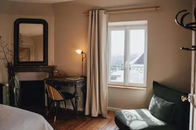 Un ou plusieurs lits dans un hébergement de l'établissement Chez Guilem chambre rose