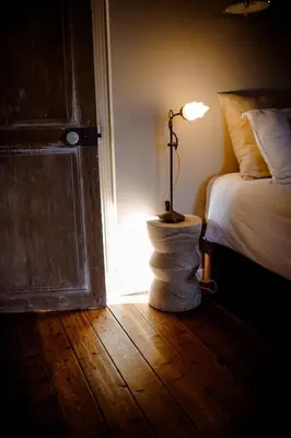 Un ou plusieurs lits dans un hébergement de l'établissement Chez Guilem chambre rose