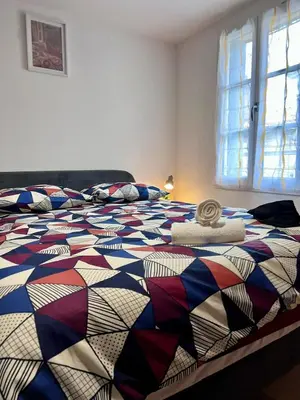 Un ou plusieurs lits dans un hébergement de l'établissement MAISON MODERNA-8 personnes-WiFi-Centre ville