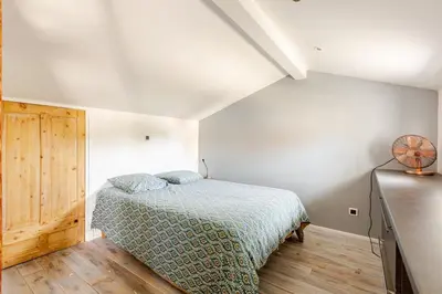Un ou plusieurs lits dans un hébergement de l'établissement L'Atelier du Clos avec Jacuzzi
